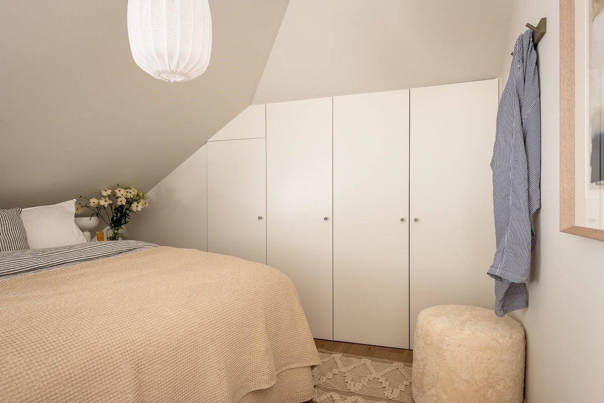 An Attic Studio Apartment with a Glass Room Divider 5 attic bedroom with built in wardrobes