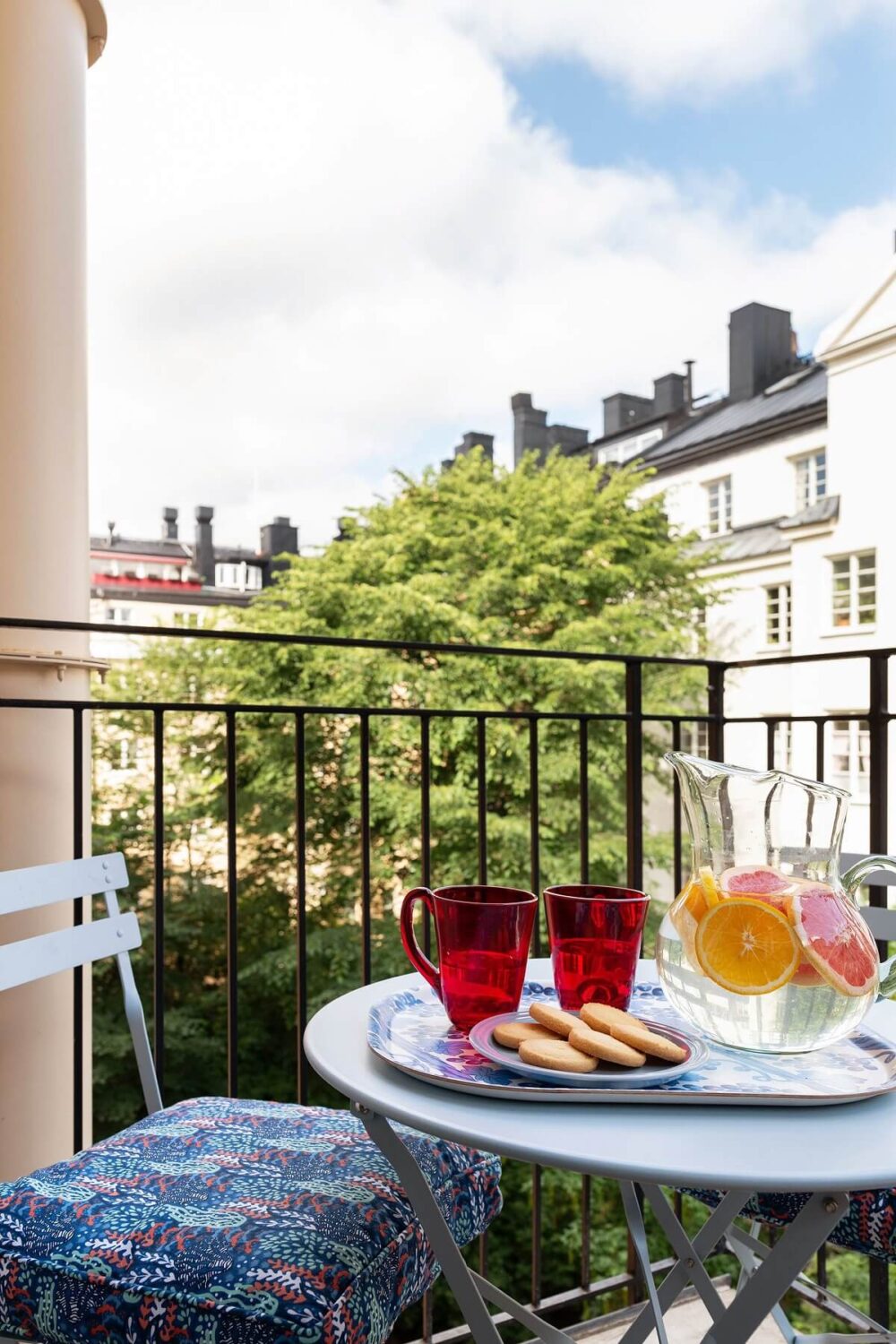 A Stockholm Apartment with Bright Green Color Accents 22 balcony bistro seating