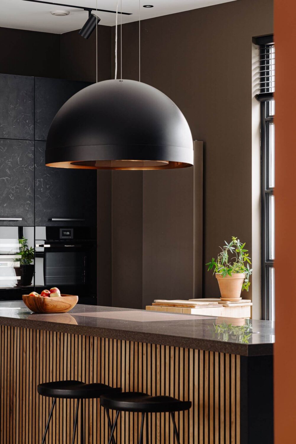 A Modern Garage Conversion in The Netherlands 9 bar seating and large pendant