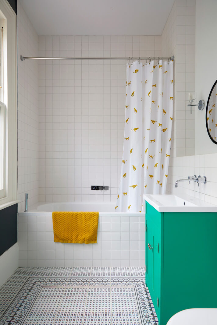 A Colorful London Family Home Renovated by Fraher & Finlay 31 bathroom with green vanity