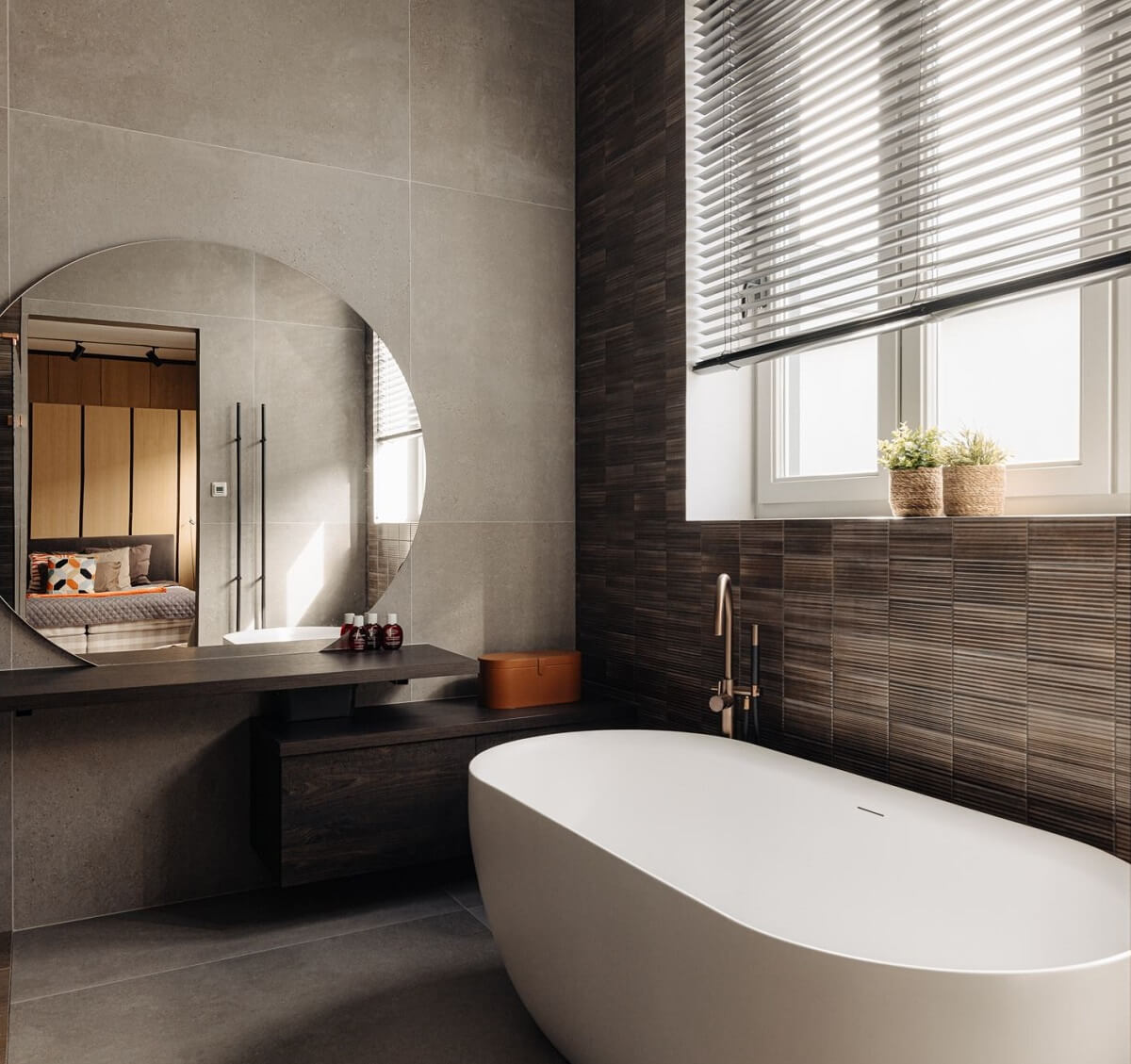 A Modern Garage Conversion in The Netherlands 21 bathroom with round mirror and bath