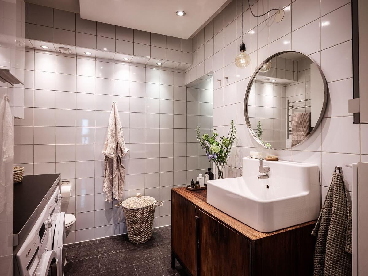 A Scandinavian Apartment with a Rust Red Bedroom 17 bathroom with wooden vanity