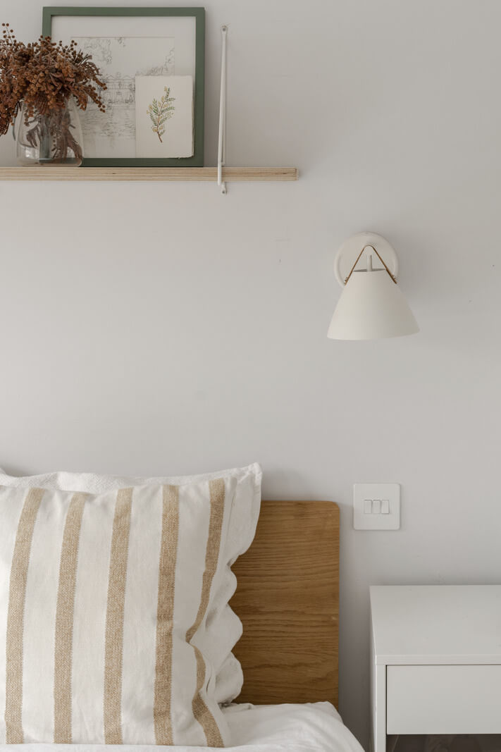 Light and Modern Spaces in a Small Victorian House 15 bedroom detail striped pillow
