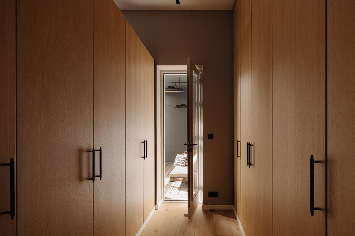 A Modern Garage Conversion in The Netherlands 17 bedroom wardrobes with door to balcony
