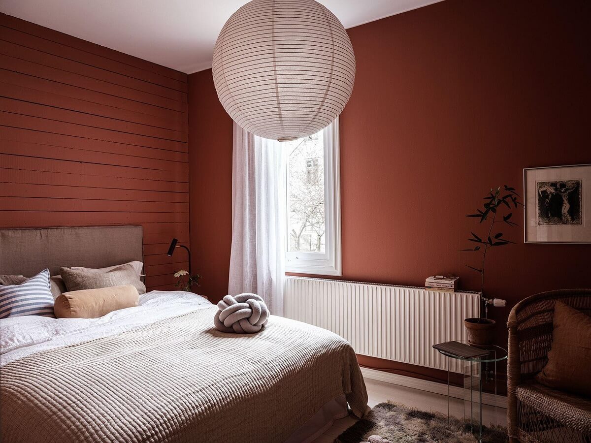 A Scandinavian Apartment with a Rust Red Bedroom 13 bedroom with deep red walls