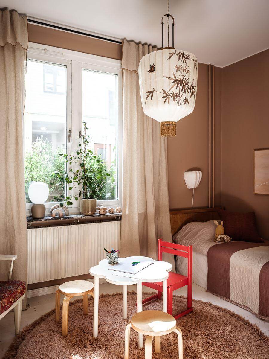 A Scandinavian Apartment with a Rust Red Bedroom 15 bedroom with earthy walls