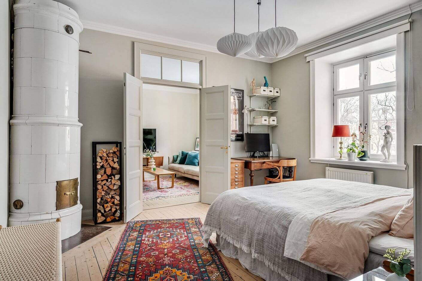 A Swedish Family Apartment with a Butter Yellow Kitchen 15 bedroom with fireplace and rug