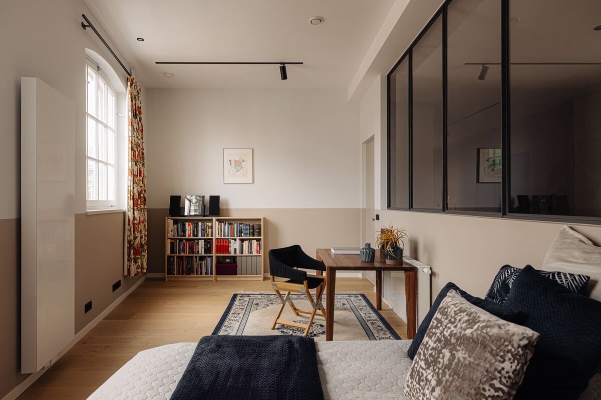 A Modern Garage Conversion in The Netherlands 23 bedroom with industrial glass wall