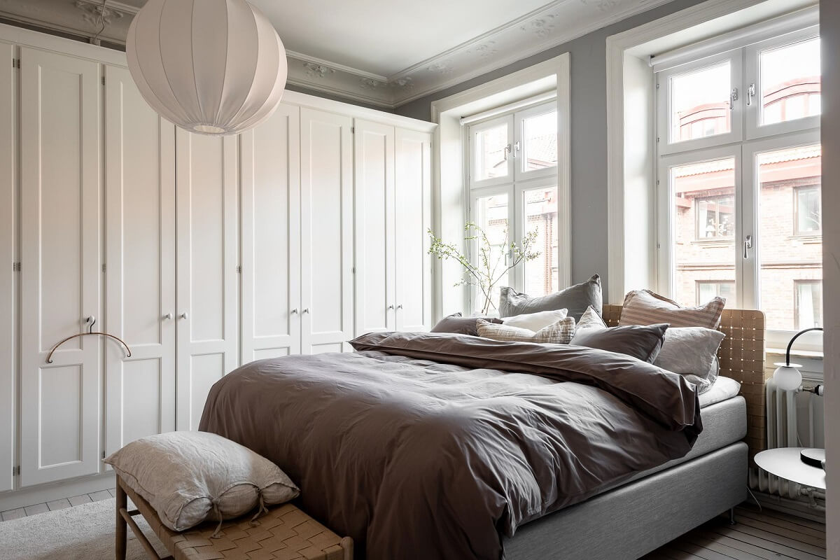 A Stylish Light Gray Swedish Apartment 17 bedroom with wardrobe wall