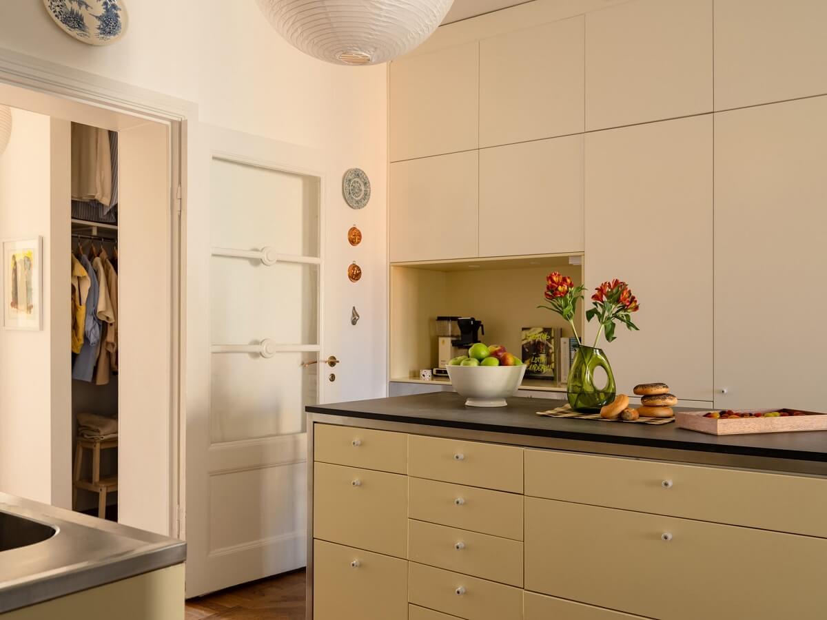 A Stockholm Apartment with Bright Green Color Accents 9 beige kitchen