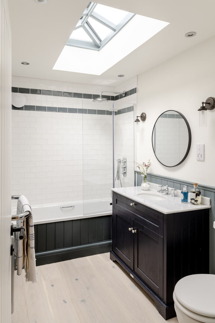 A Modern Barn House in the English Countryside 14 black and white bathroom with rooflight