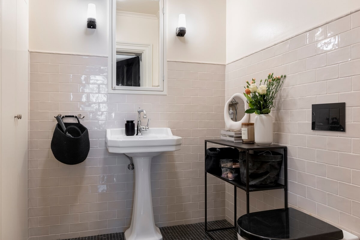 A Pink Apartment with a Black Kitchen 10 black and white bathroom