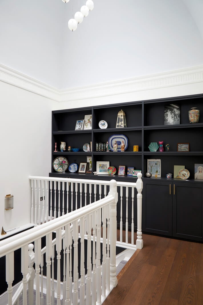 A Colorful London Family Home Renovated by Fraher & Finlay 23 black cabinets landing