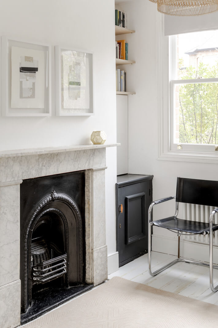 Light and Modern Spaces in a Small Victorian House 4 black fireplace white living room