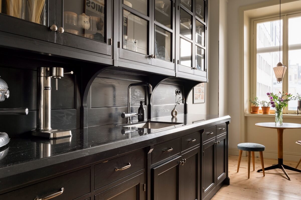 A Pink Apartment with a Black Kitchen 14 black kitchen with glass upper cabinets nordroom