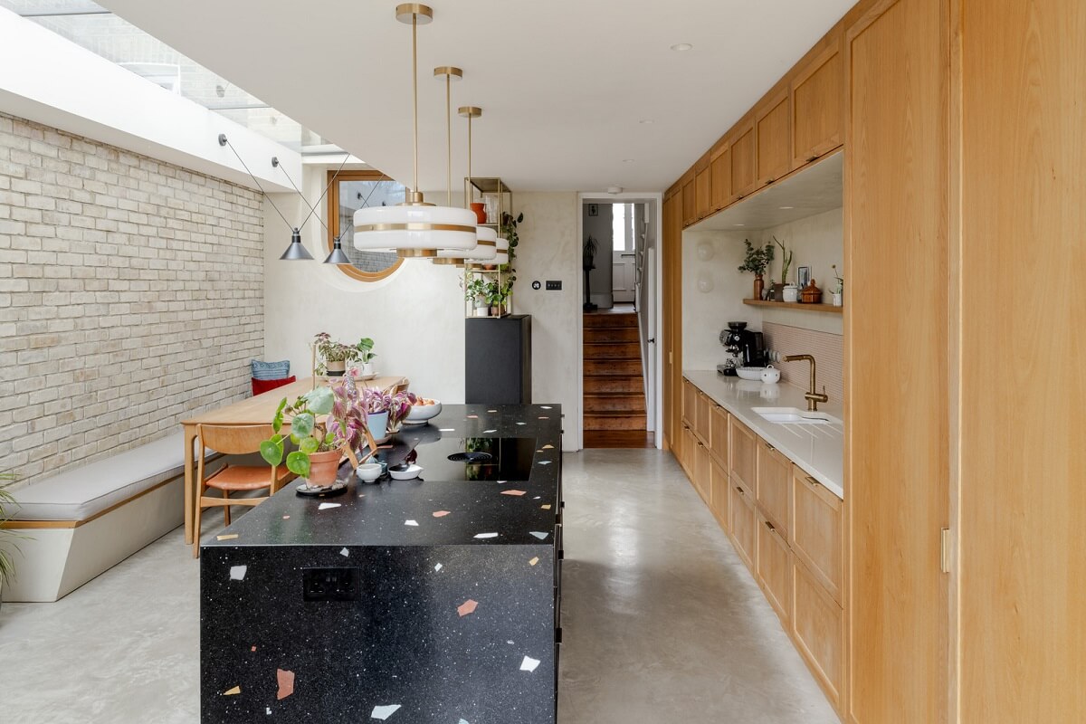 A Light London Family House with a Modern Extension 8 black terrazzo kitchen island