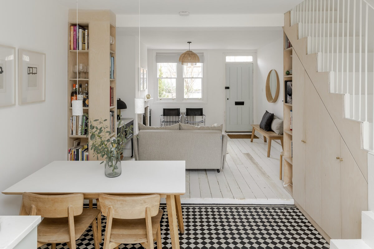 Light and Modern Spaces in a Small Victorian House 6 black white floor tiles dining table under stairs storage