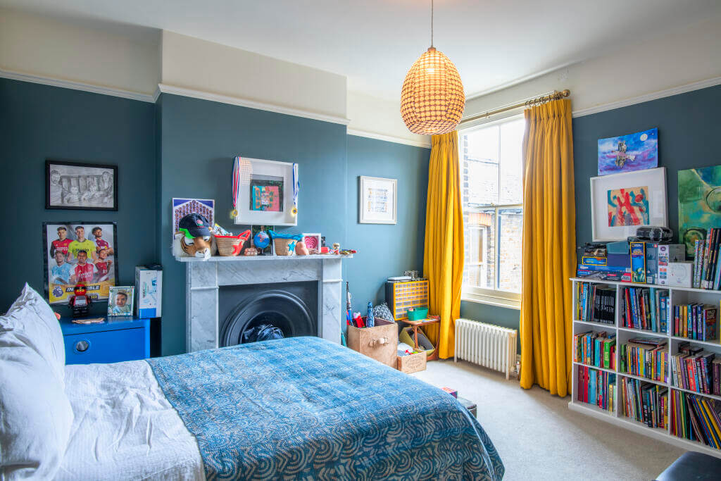A Victorian House where the Kitchen is the Heart of the Home 13 blue bedroom with yellow curtains