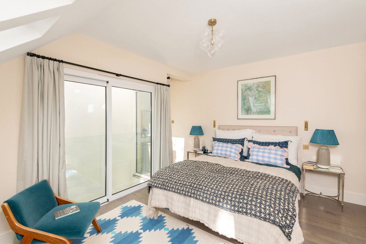 A Light London Maisonette in a Former Artist's Studio 19 blue color accents in bedroom