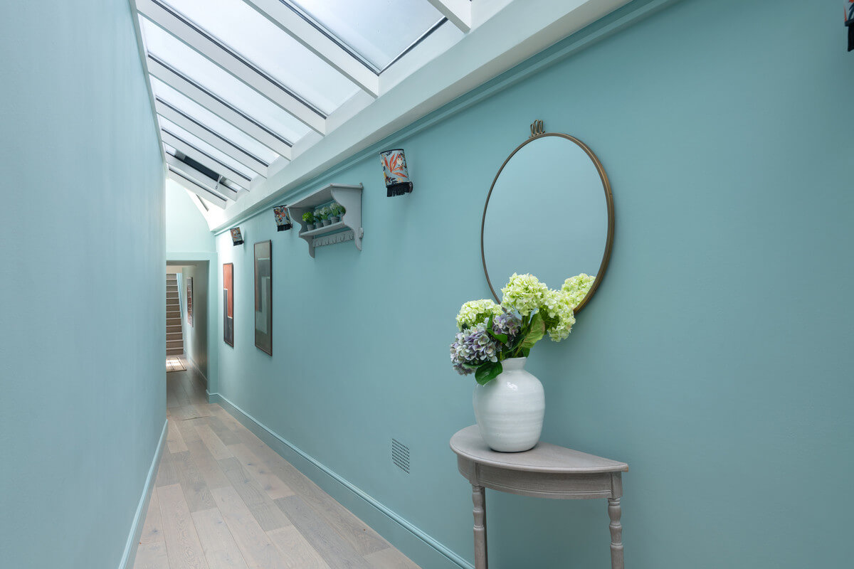 A Light London Maisonette in a Former Artist's Studio 25 blue hallway with skylight