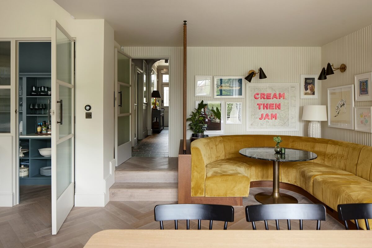 Historic Features and Modern Design in an English Regency Villa 9 breakfast nook with mustard yellow curved bench