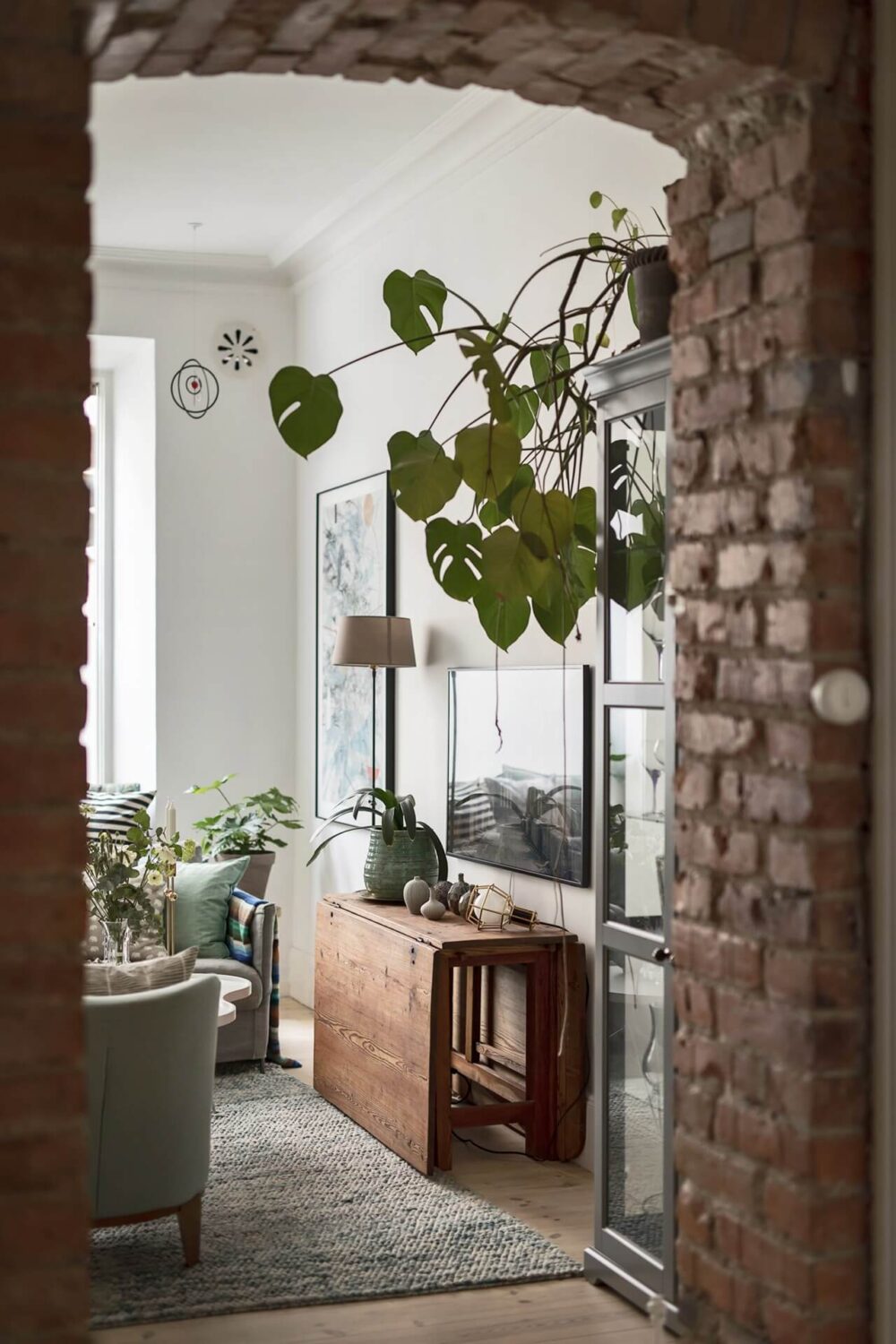 A Swedish Apartment with an Exposed Brick Wall 9 brick doorway