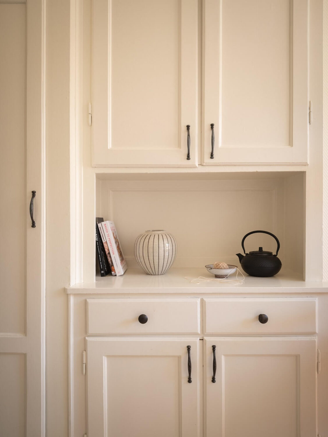 Calm Color Tones in a Light Scandinavian Studio Apartment 12 built in kitchen cabinet