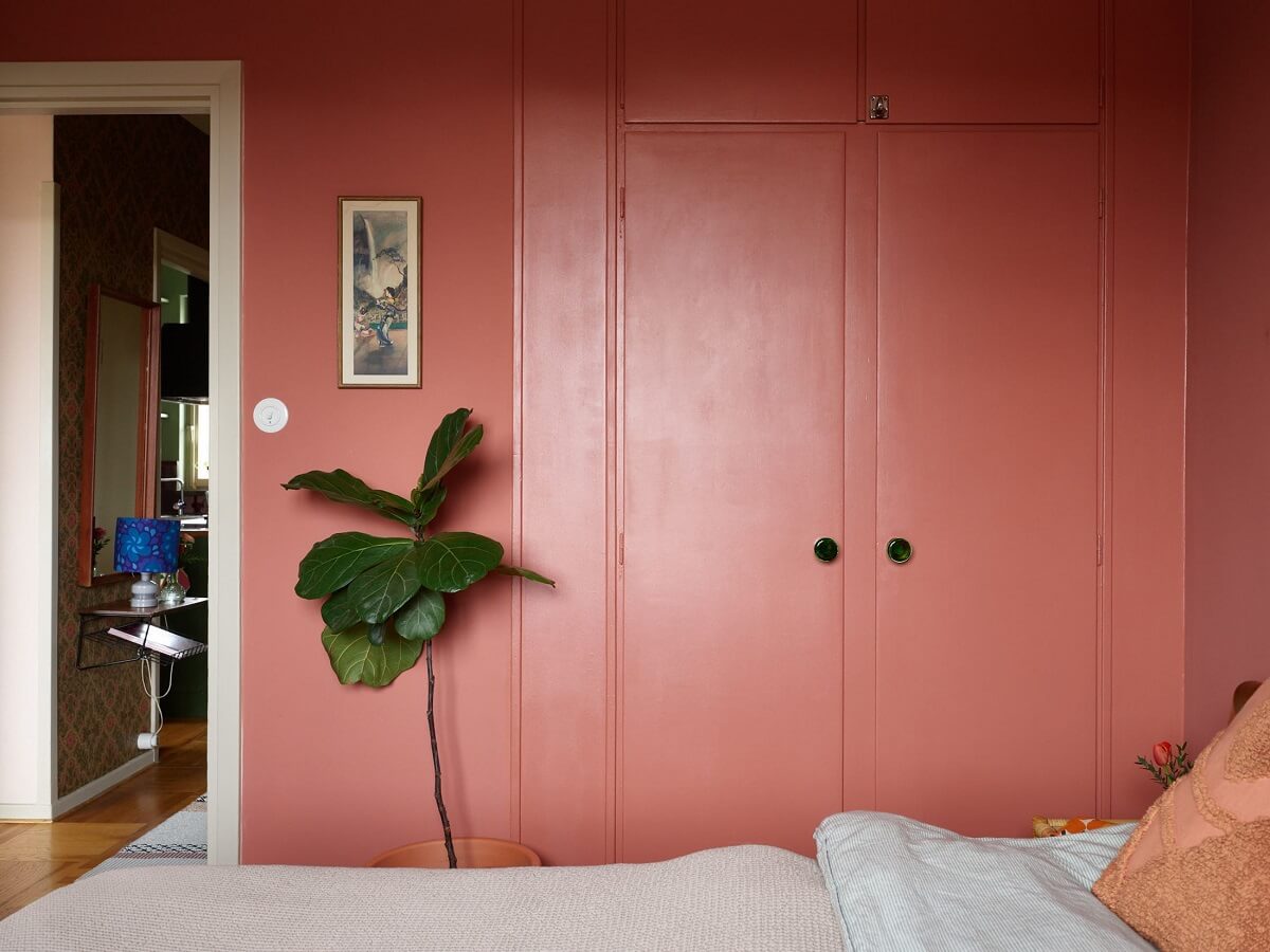 Revisiting a Small Green and Pink Midcentury Apartment 19 built in wardrobes in pink bedroom