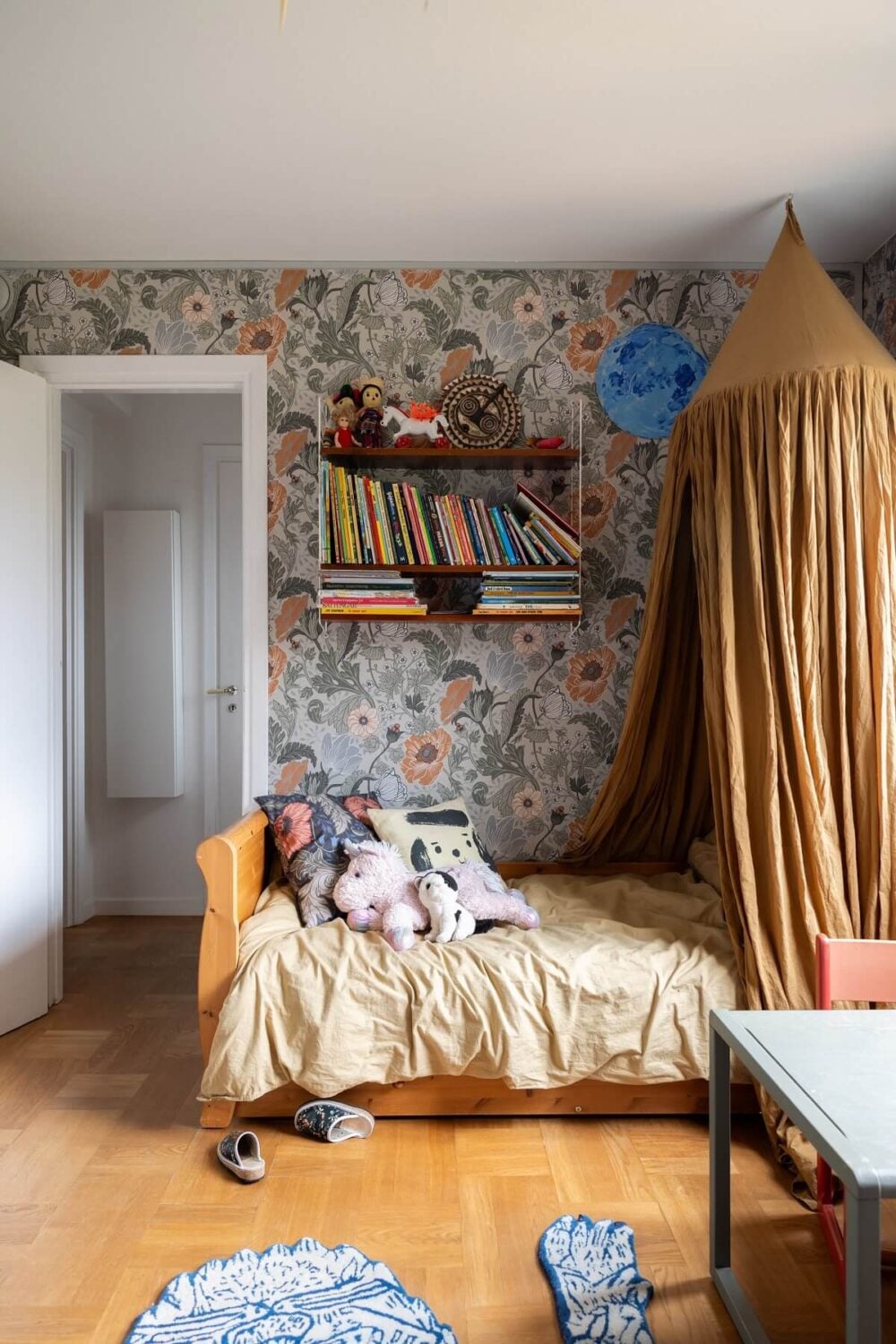 A Swedish Family House with Wall Murals and Art 17 children room with wallpaper and ochre canopy