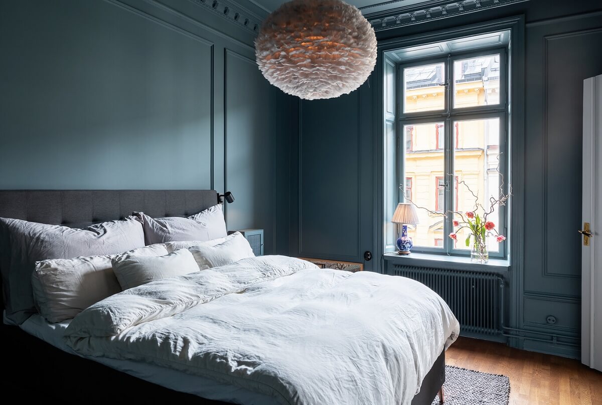 A Classic Swedish Apartment with a Dark Blue Bedroom 14 classic dark blue scandinavian bedroom
