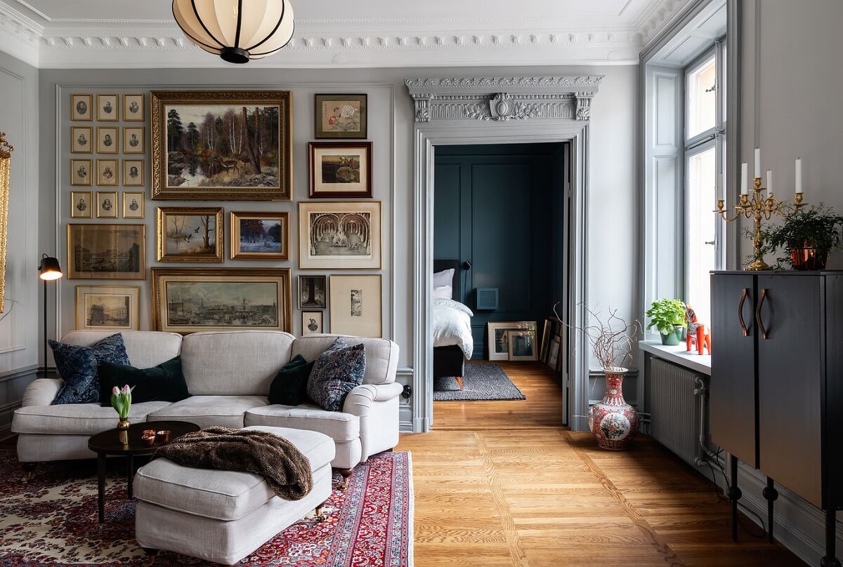 A Classic Swedish Apartment with a Dark Blue Bedroom 1 classic living room with light gray walls and art