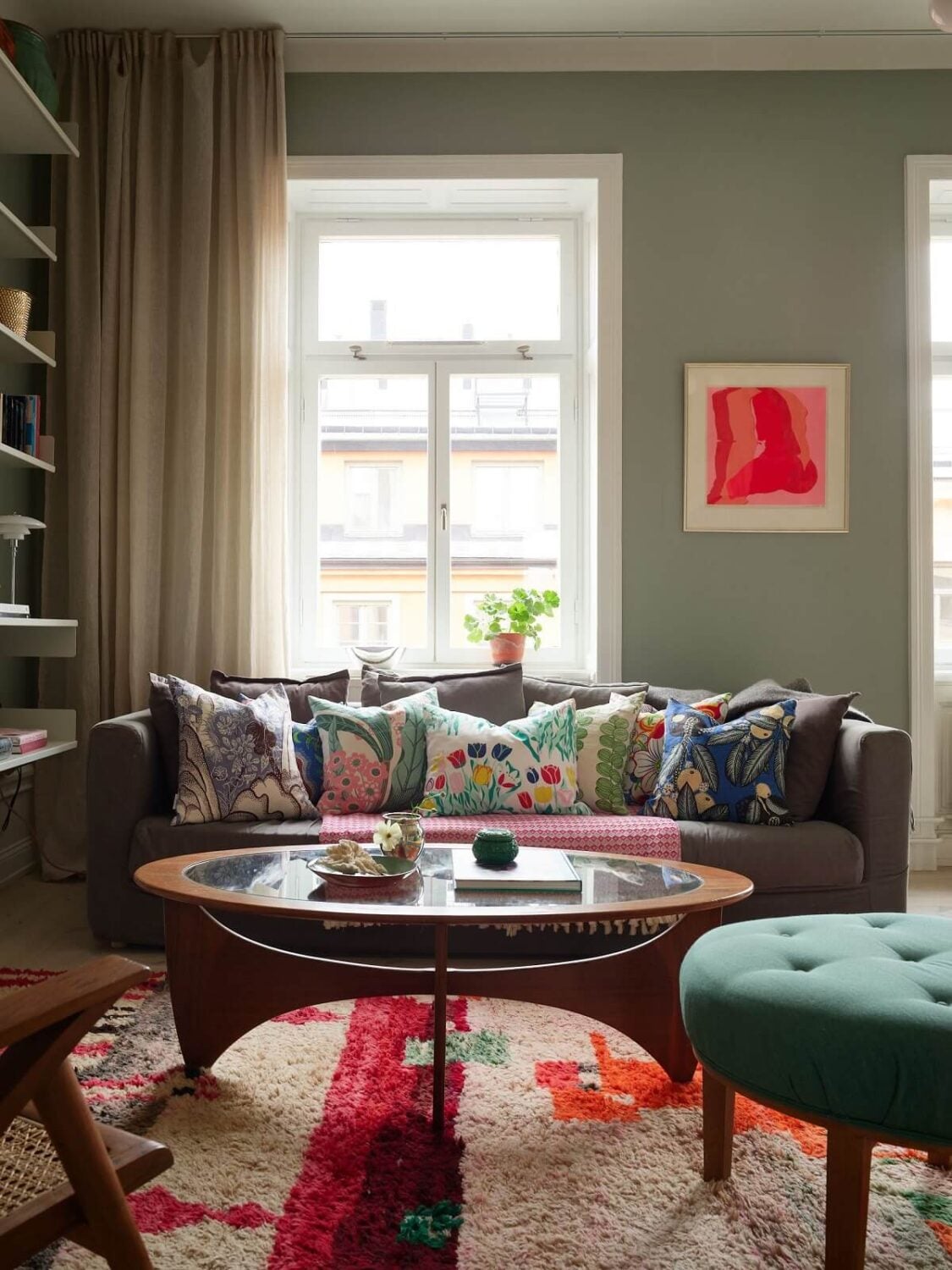 A Green Kitchen in a Gray Family Apartment 4 colorful rug in living room