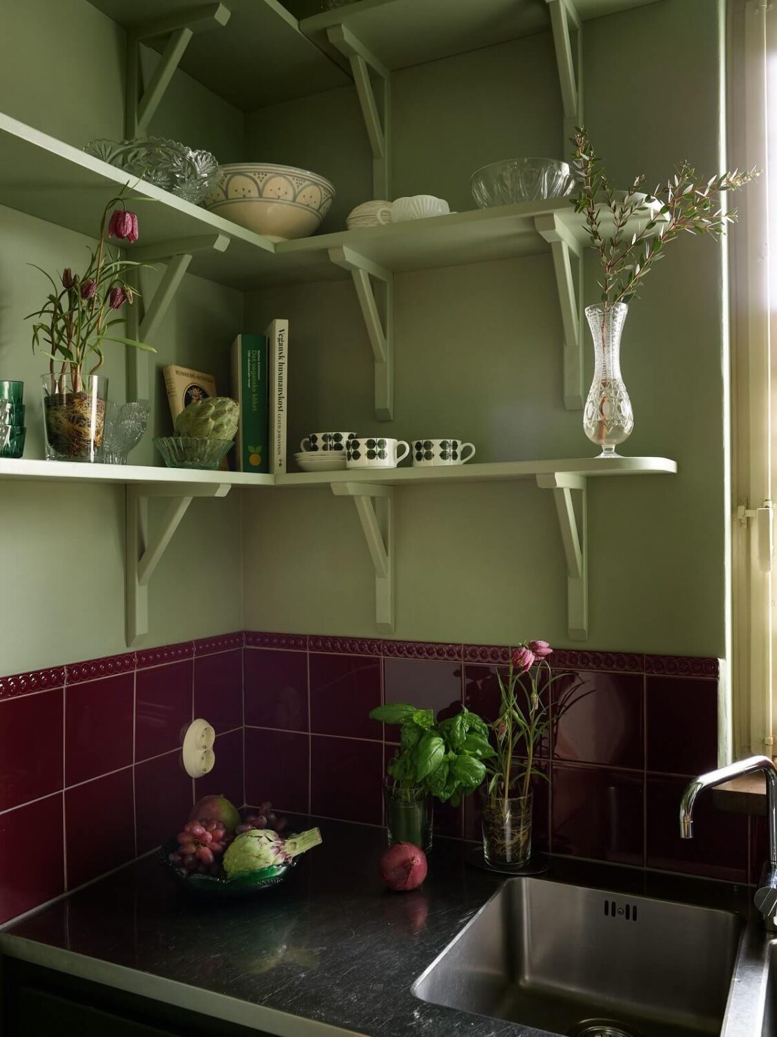 Revisiting a Small Green and Pink Midcentury Apartment 4 corner shelves in small midcentury kitchen