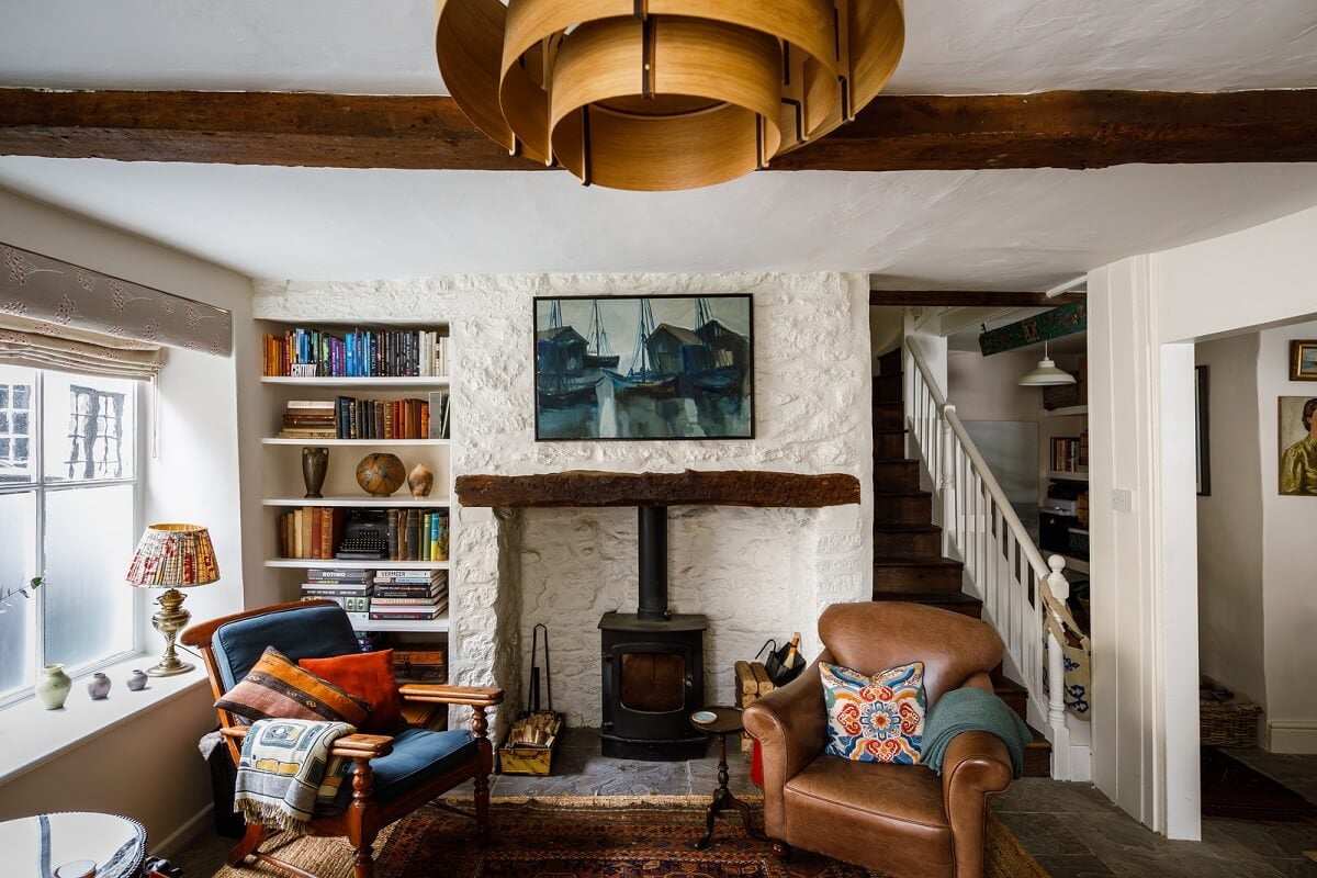 A Charming English Cottage Filled with Historic Character 1 cottage living room with fireplace and exposed beams