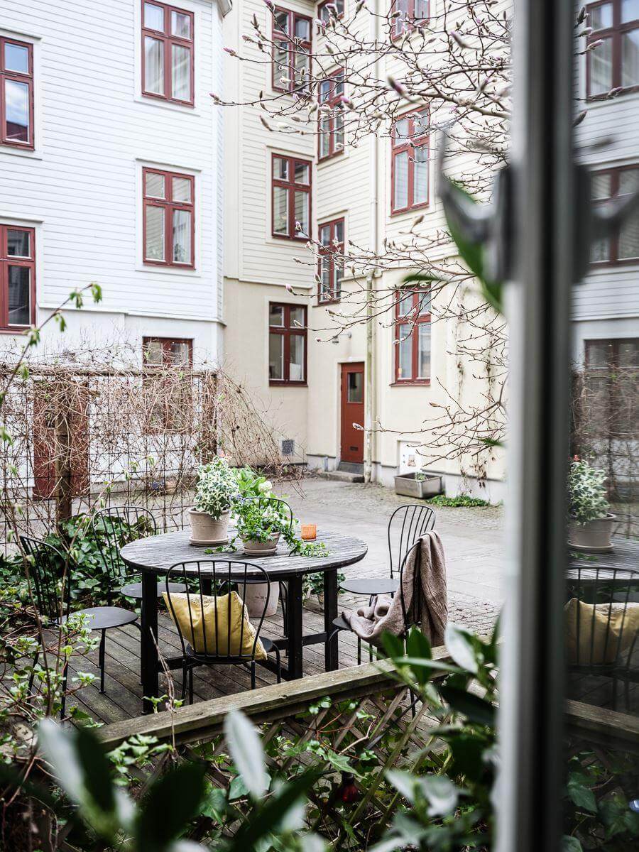 A Scandinavian Apartment with a Rust Red Bedroom 19 courtyard terrace
