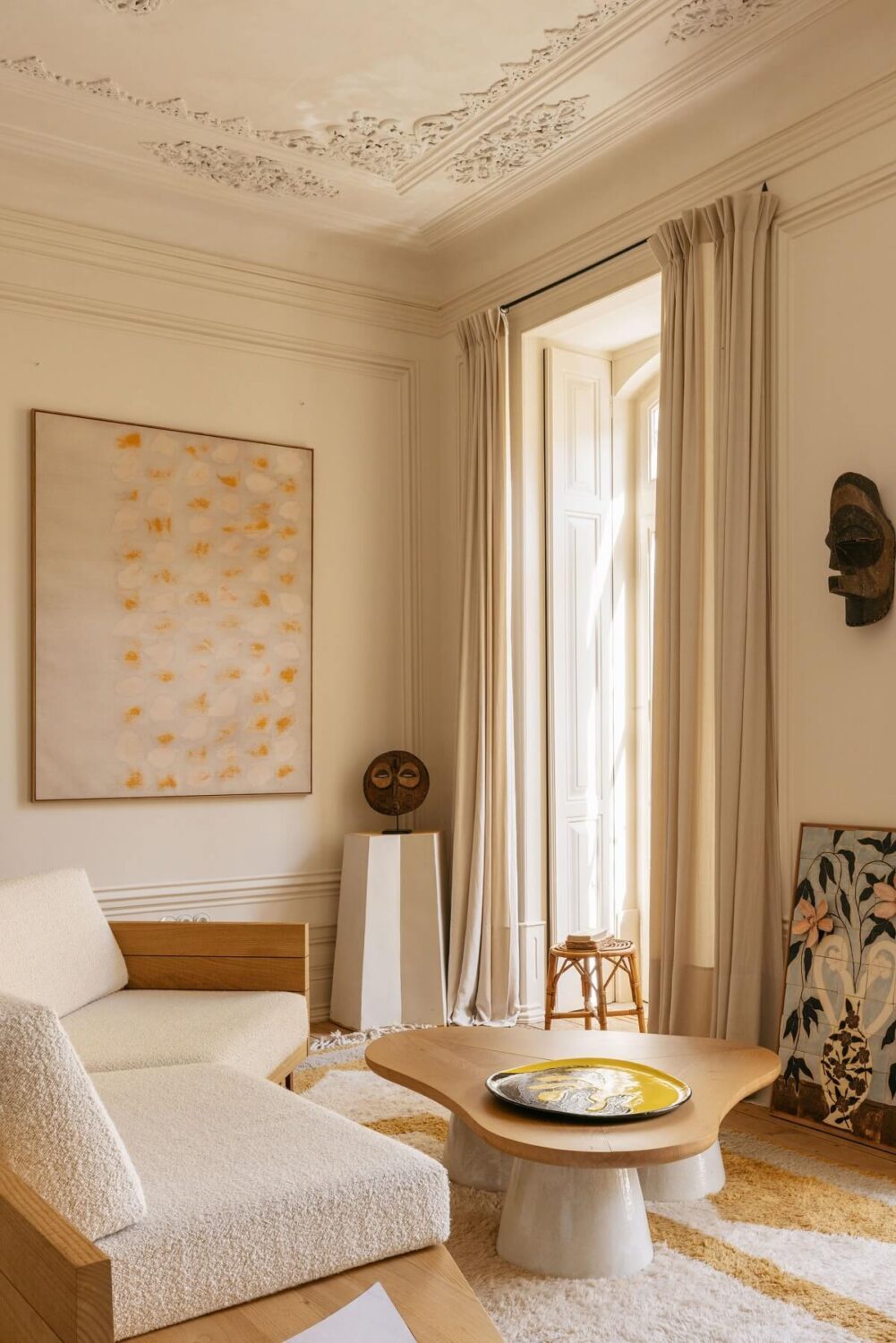 The Gallery Home: A Custom-Built Design Apartment in Portugal 2 curved sofa in light living room
