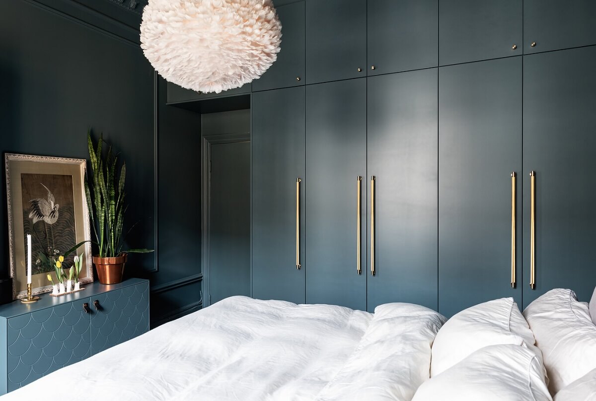 A Classic Swedish Apartment with a Dark Blue Bedroom 15 dark blue bedroom with built in wardrobes