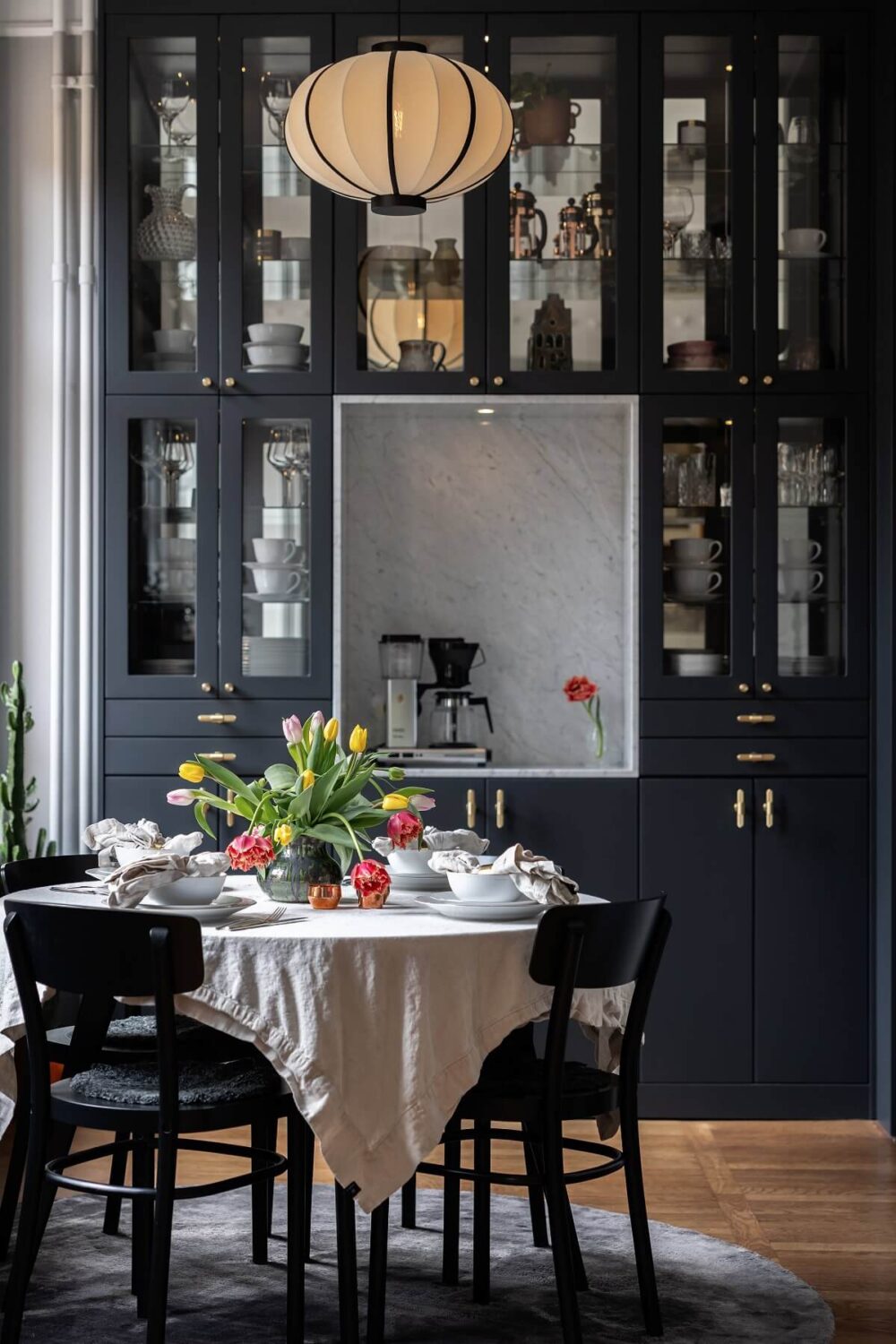 A Classic Swedish Apartment with a Dark Blue Bedroom 6 dark blue cabinets with glass fronts