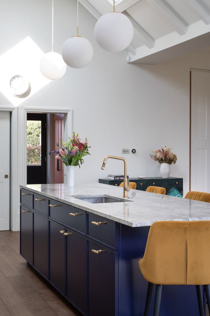 A Colorful London Family Home Renovated by Fraher & Finlay 11 dark blue kitchen island