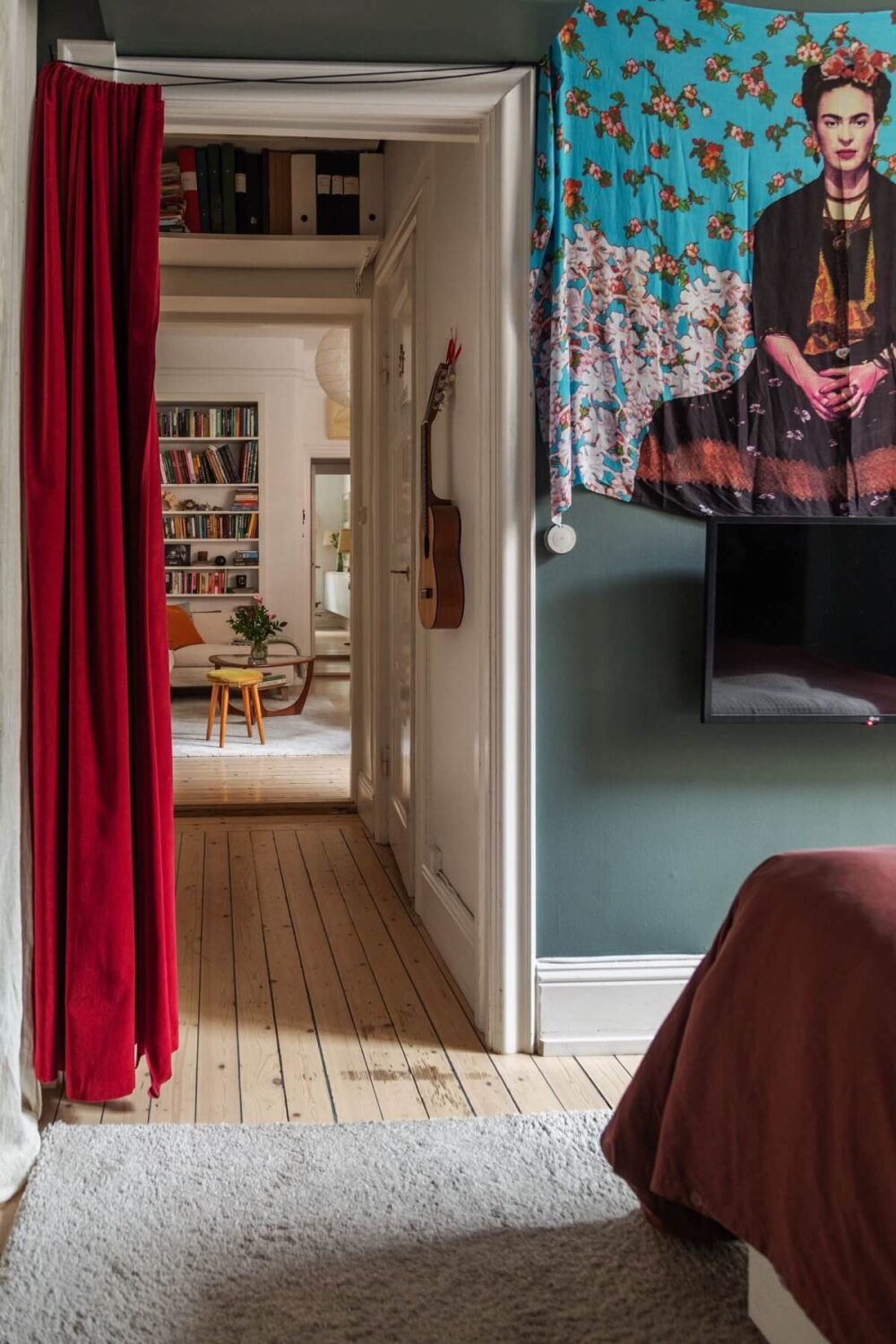 Period Details and Light Rooms in a Scandinavian Apartment 19 dark gray bedroom red curtain