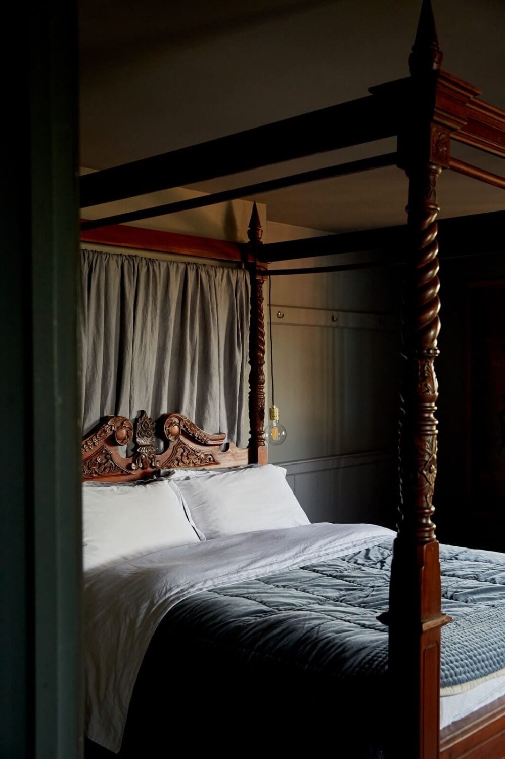 A Georgian House in England with a Ballroom 17 dark gray bedroom with antique poster bed