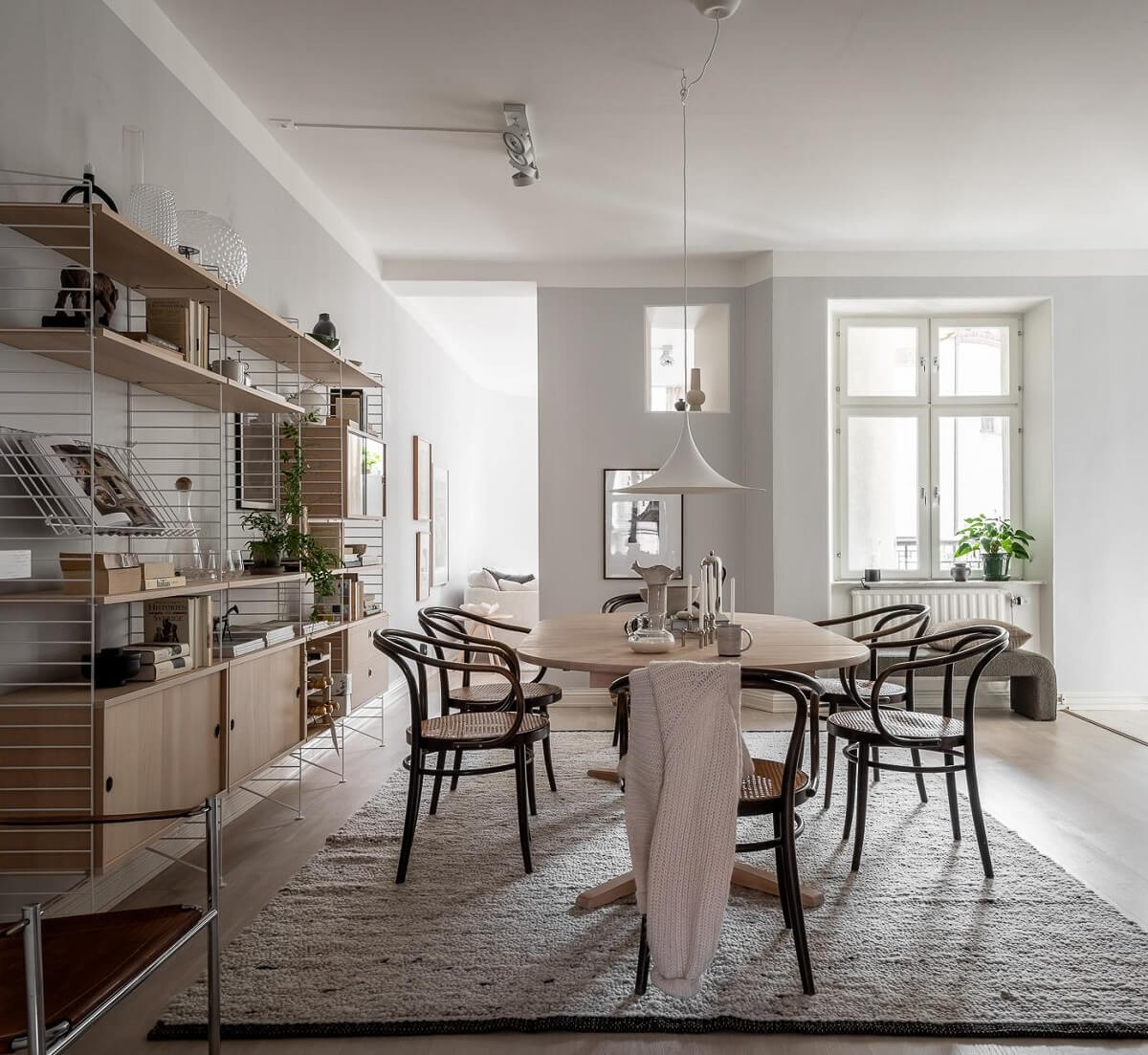 A Stylish Light Gray Swedish Apartment 8 dining room with string shelves