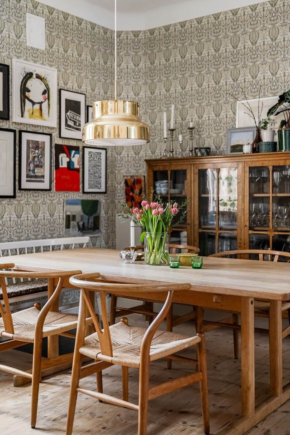 A Swedish Family Apartment with a Butter Yellow Kitchen 7 dining room with wallpaper