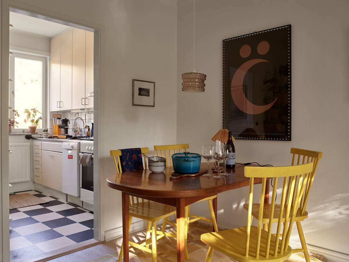 A Swedish Apartment with a Tiny Terracotta Brown Bedroom 10 dining space with yellow chair