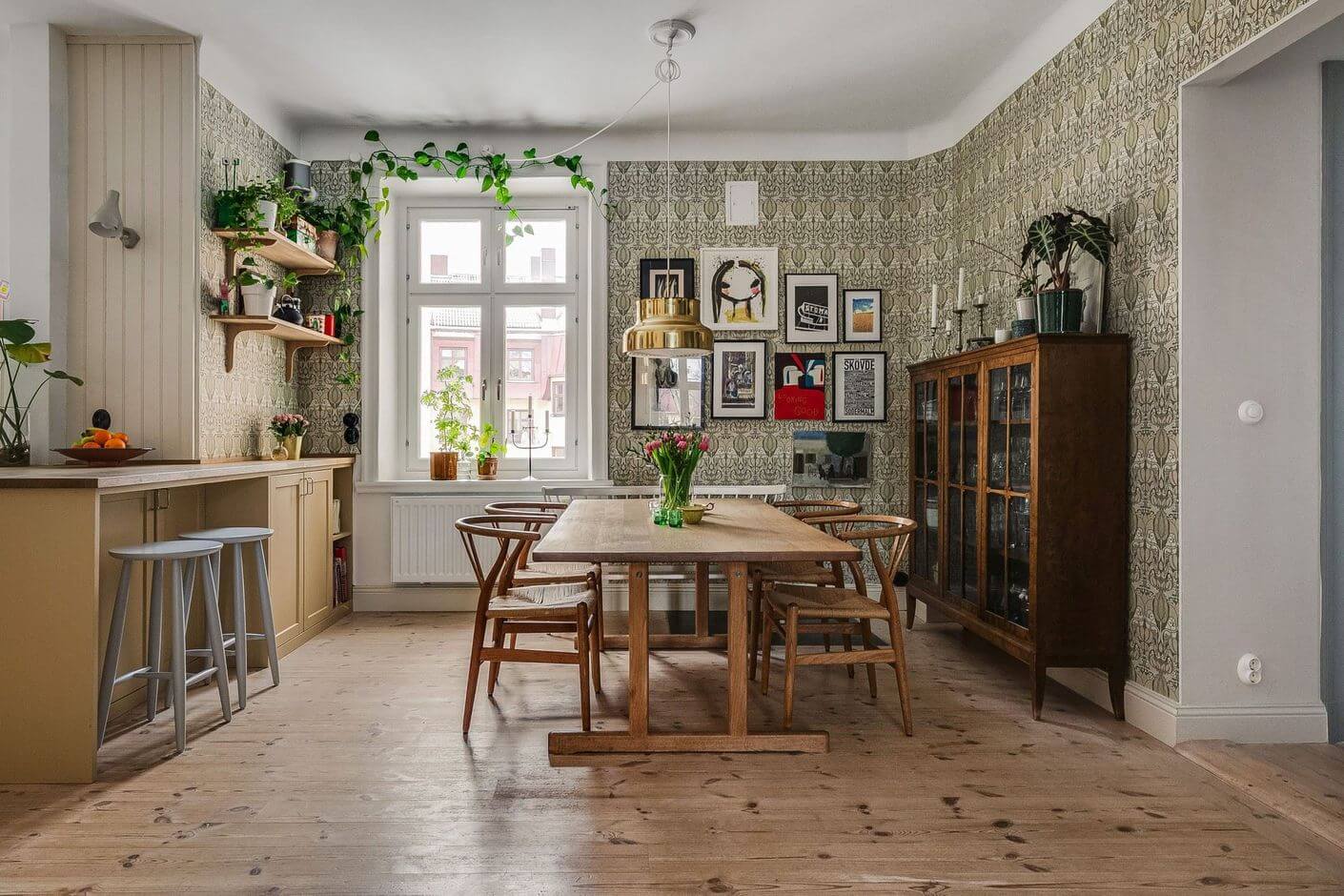 A Swedish Family Apartment with a Butter Yellow Kitchen 6 dining table with wallpaper