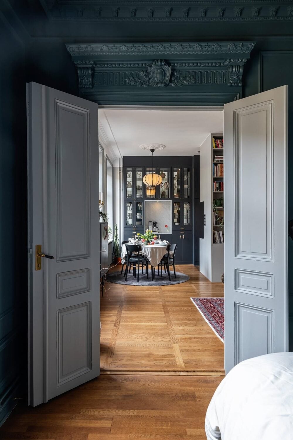 A Classic Swedish Apartment with a Dark Blue Bedroom 16 double wooden doors classic apartment