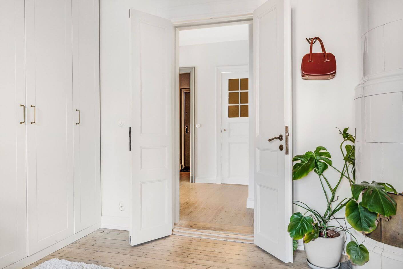 A Swedish Family Apartment with a Butter Yellow Kitchen 19 double wooden doors