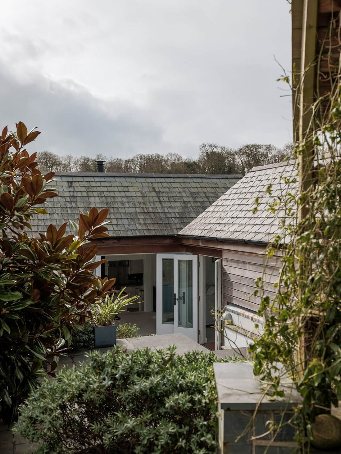 A Coastal White Painter's Home with Reclaimed Features in Cornwall 26 garden house view