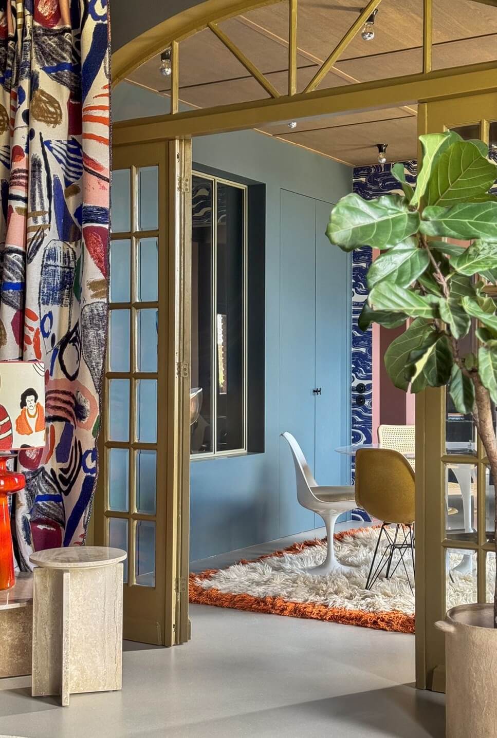 Color and Graphic Design in the Home of a Dutch Interior Stylist 22 glass doors bedroom with colorful curtains