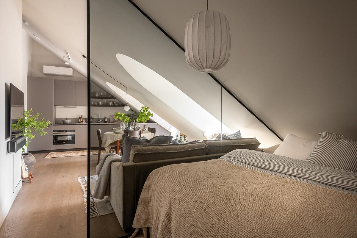 An Attic Studio Apartment with a Glass Room Divider 6 glass triangle room divider studio apartment nordroom